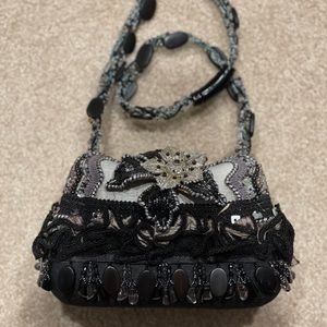 Mary Frances bag. Mint condition, never worn. Comes with duster bag.